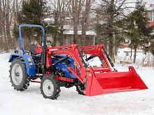 Быстросъемный фронтальный погрузчик с челюстным ковшом